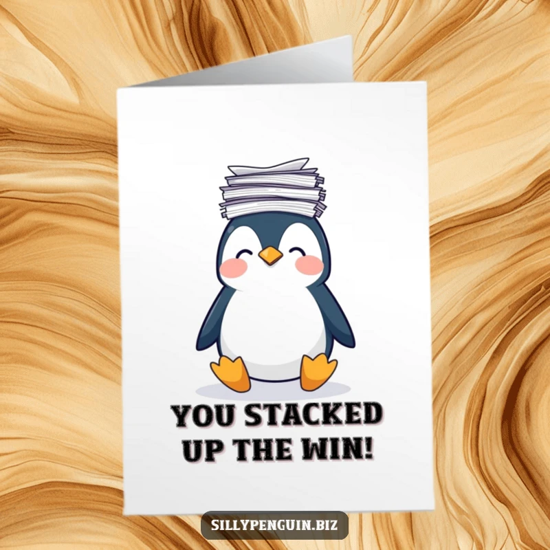 Funny free printable congratulations card of a penguin struggling to balance a huge pile of papers on its head.